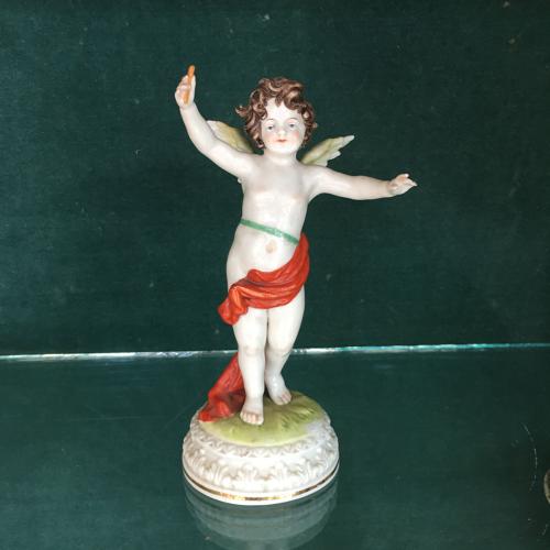 Porcelain cherub figure