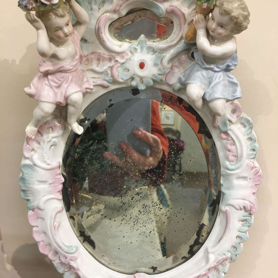 Antique china putti mirror