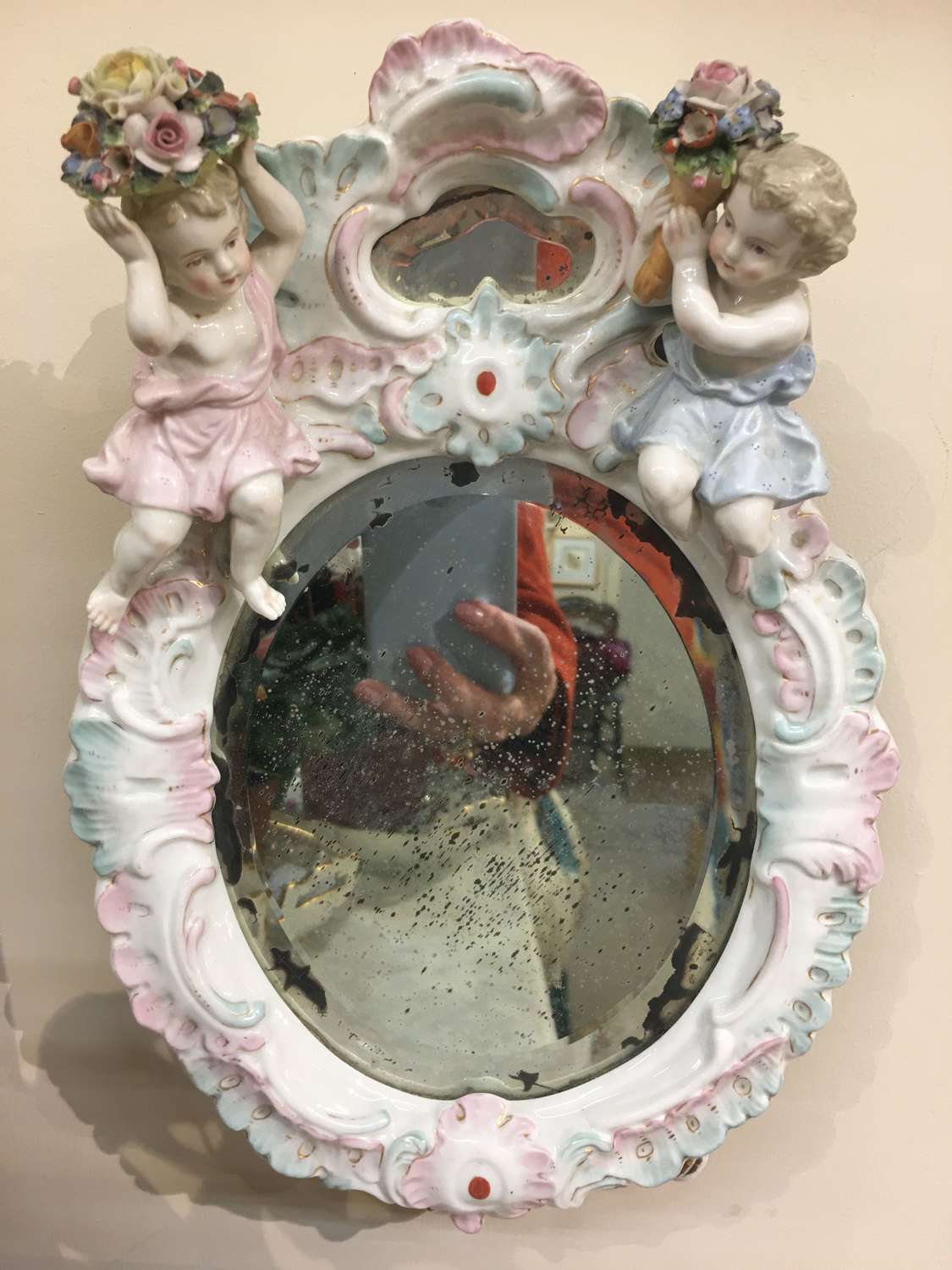 Antique china putti mirror