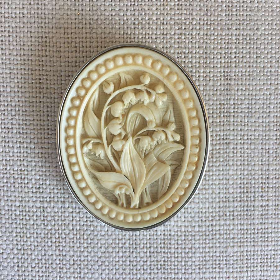 Oval celluloid floral cameo silver framed