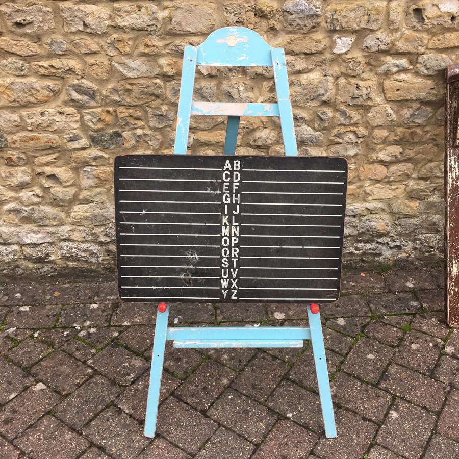 Vintage blue painted easel and blackboard