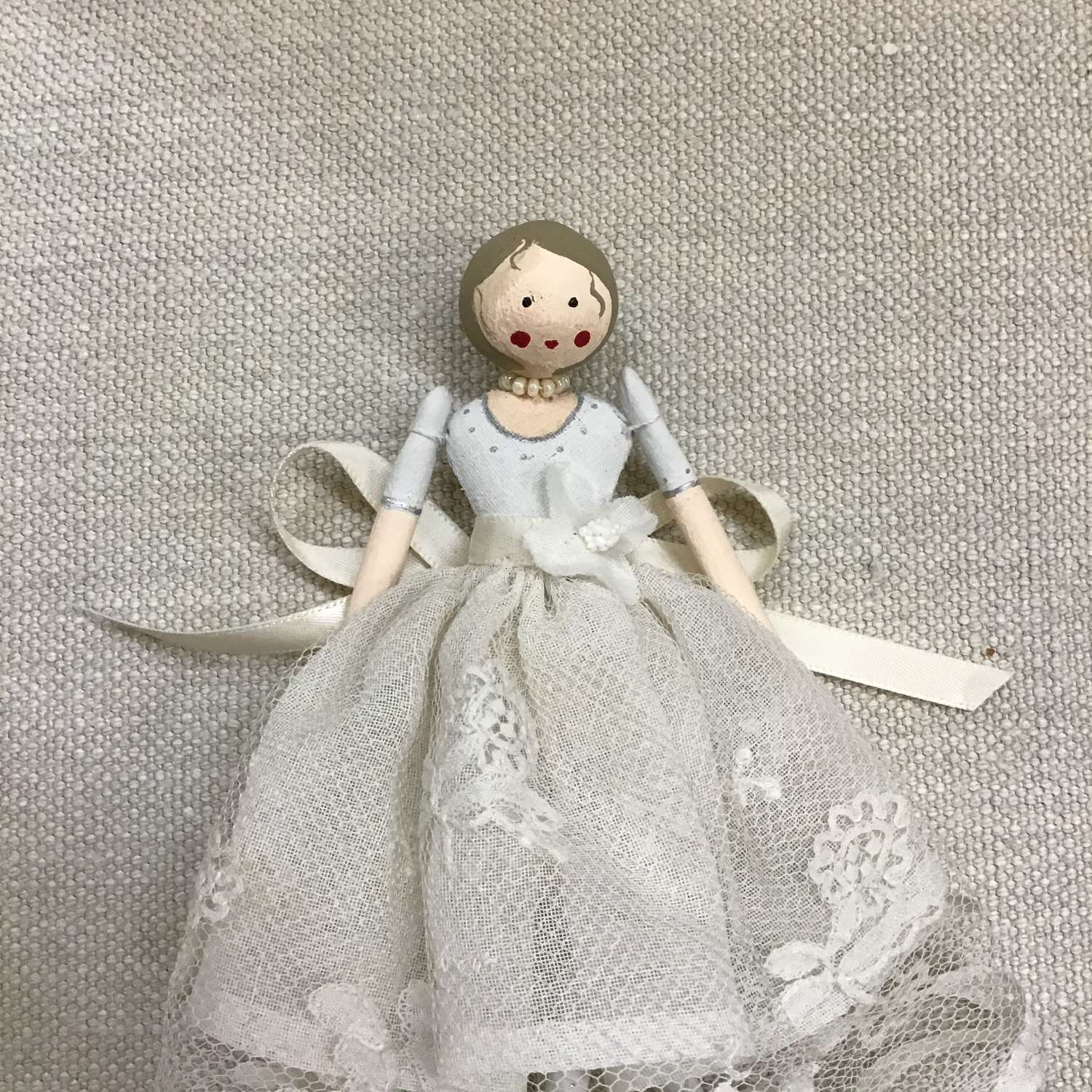 Hand crafted paper clay doll dressed in vintage fabrics and trims