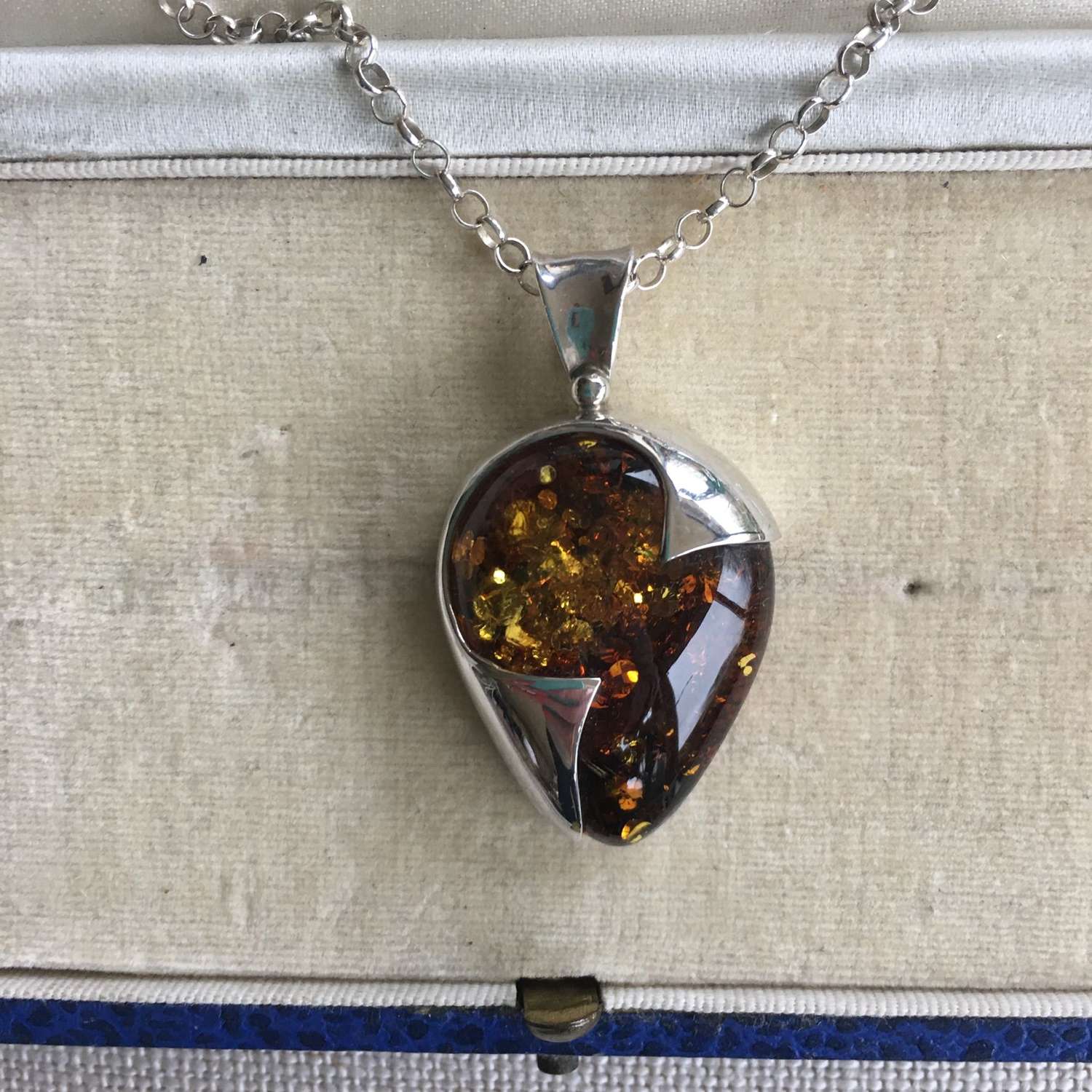 Silver and amber necklace on silver chain