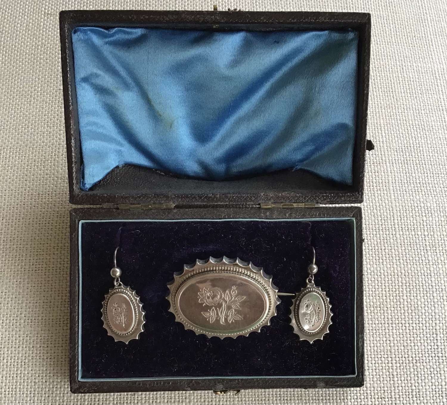 Victorian silver locket brooch and matching earrings in original box