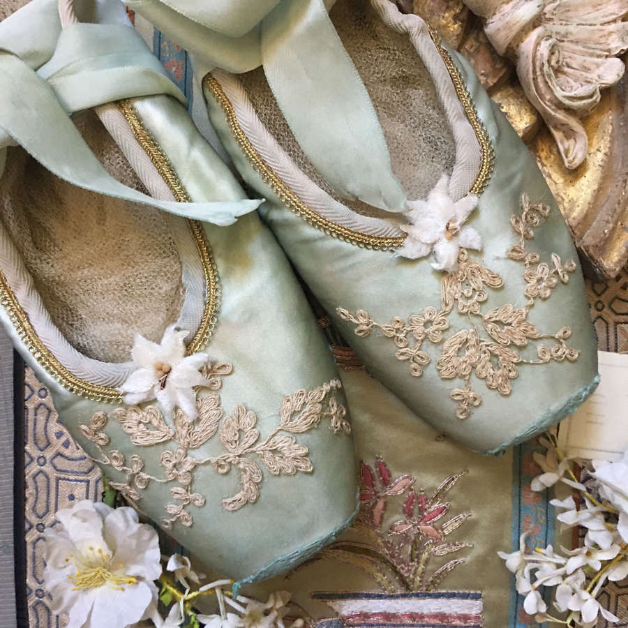 Decorative vintage green satin ballet shoes