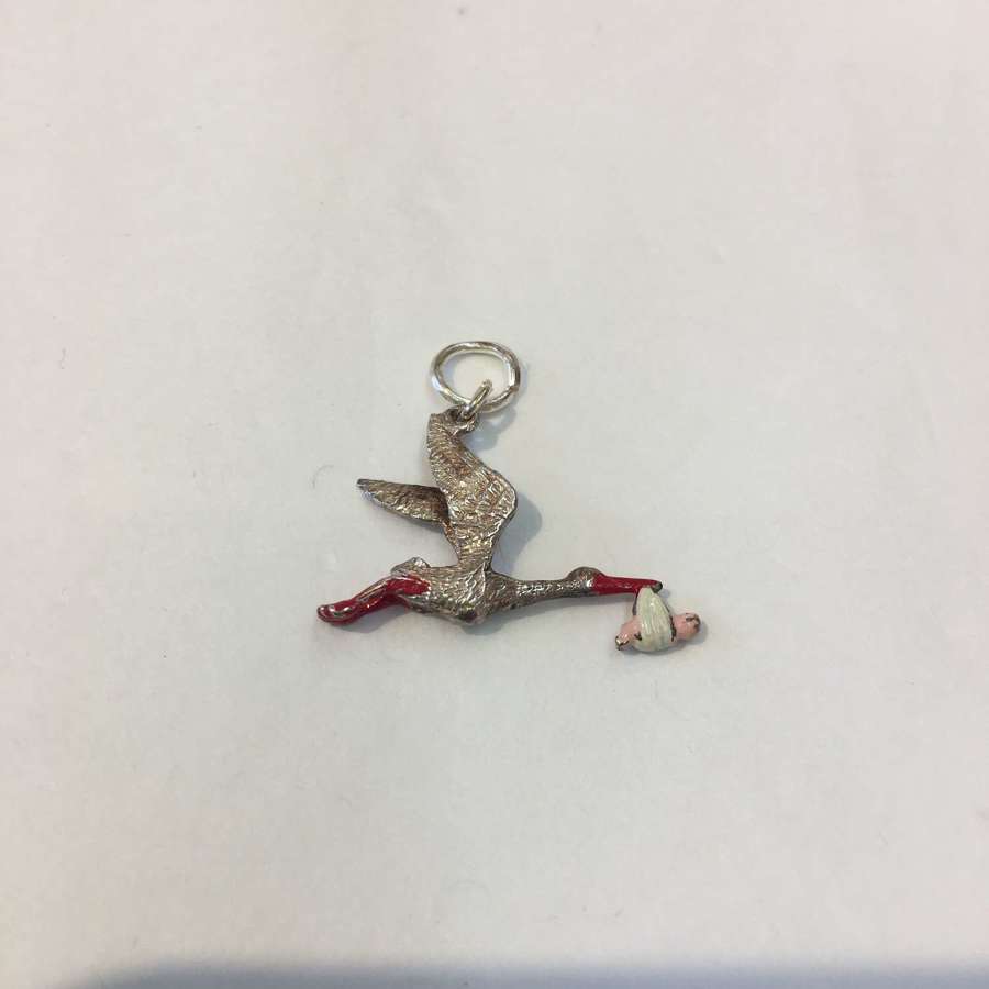 Vintage silver and enamel stork and baby charm