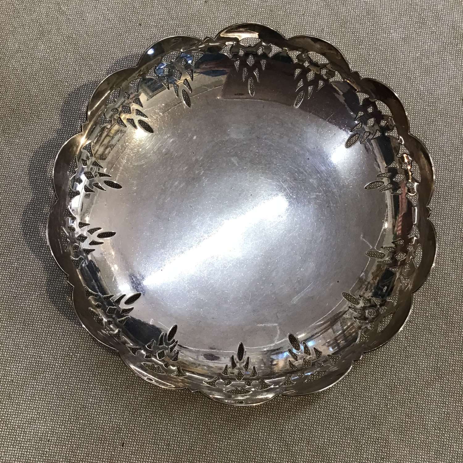 Round scallop edged silver plate dish on legs by Ancora