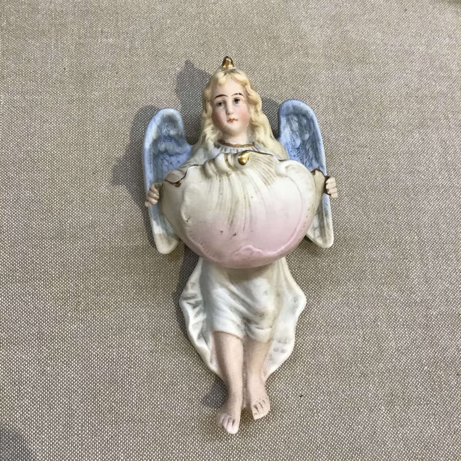 Antique angel holy water font