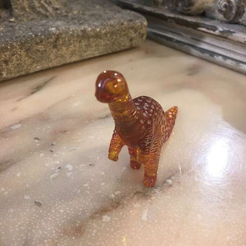 Amber dinosaur ornament