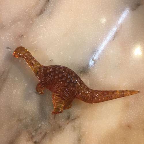Amber dinosaur ornament