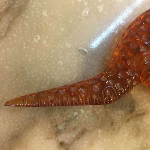 Amber dinosaur ornament