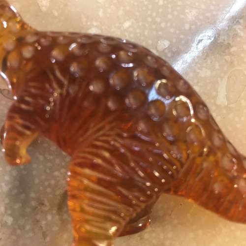 Amber dinosaur ornament