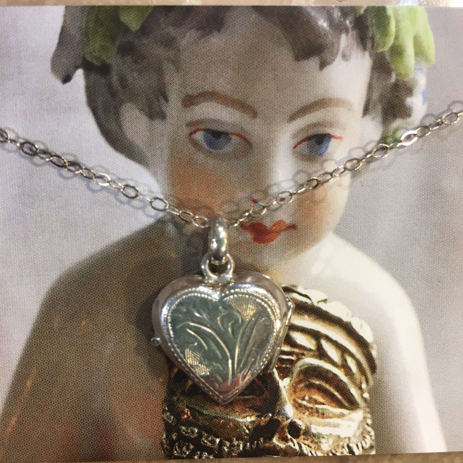 Vintage engraved silver locket on silver chain