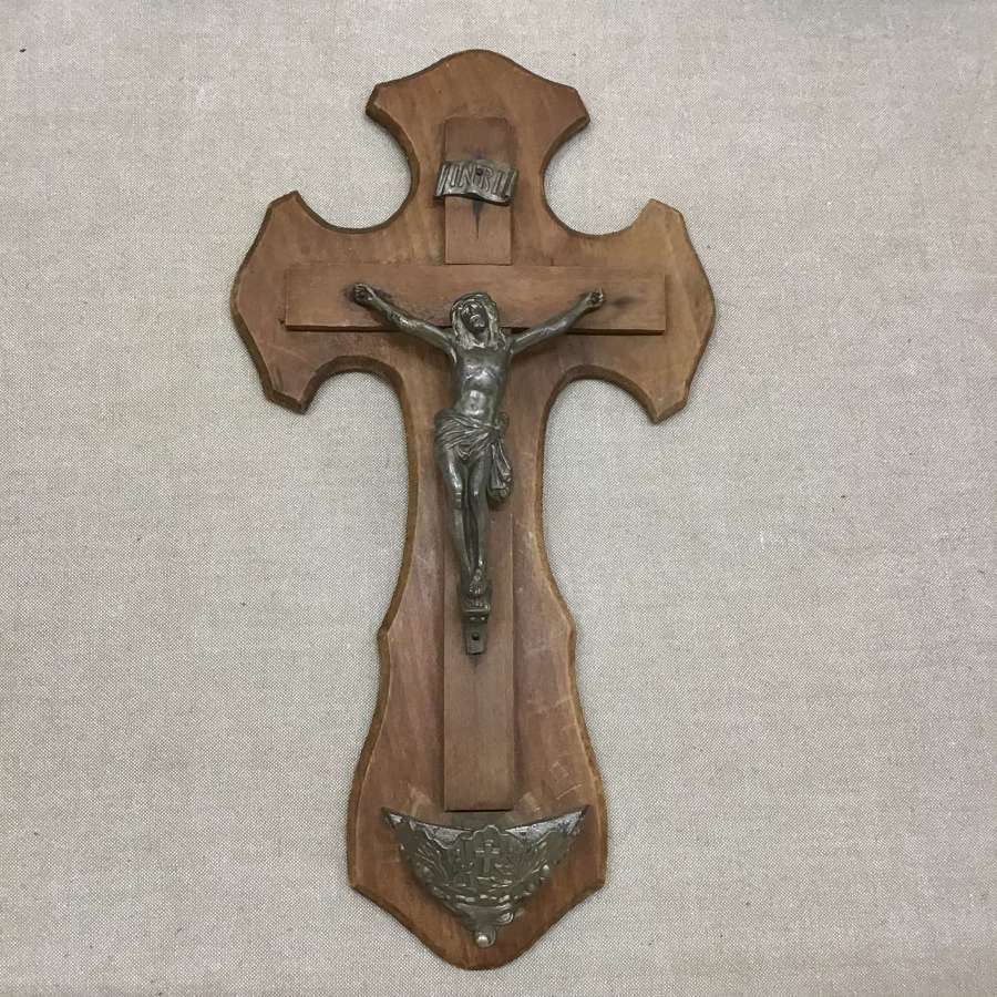 Old wooden crucifix with holy water font