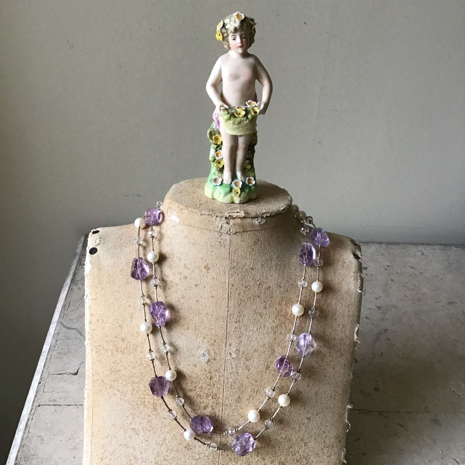 An amethyst, pearl and silver necklace
