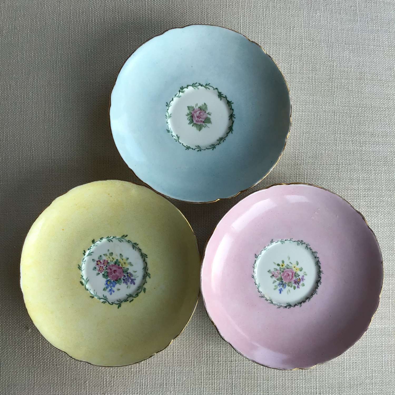 Three pretty vintage Shelley England bone china floral saucers