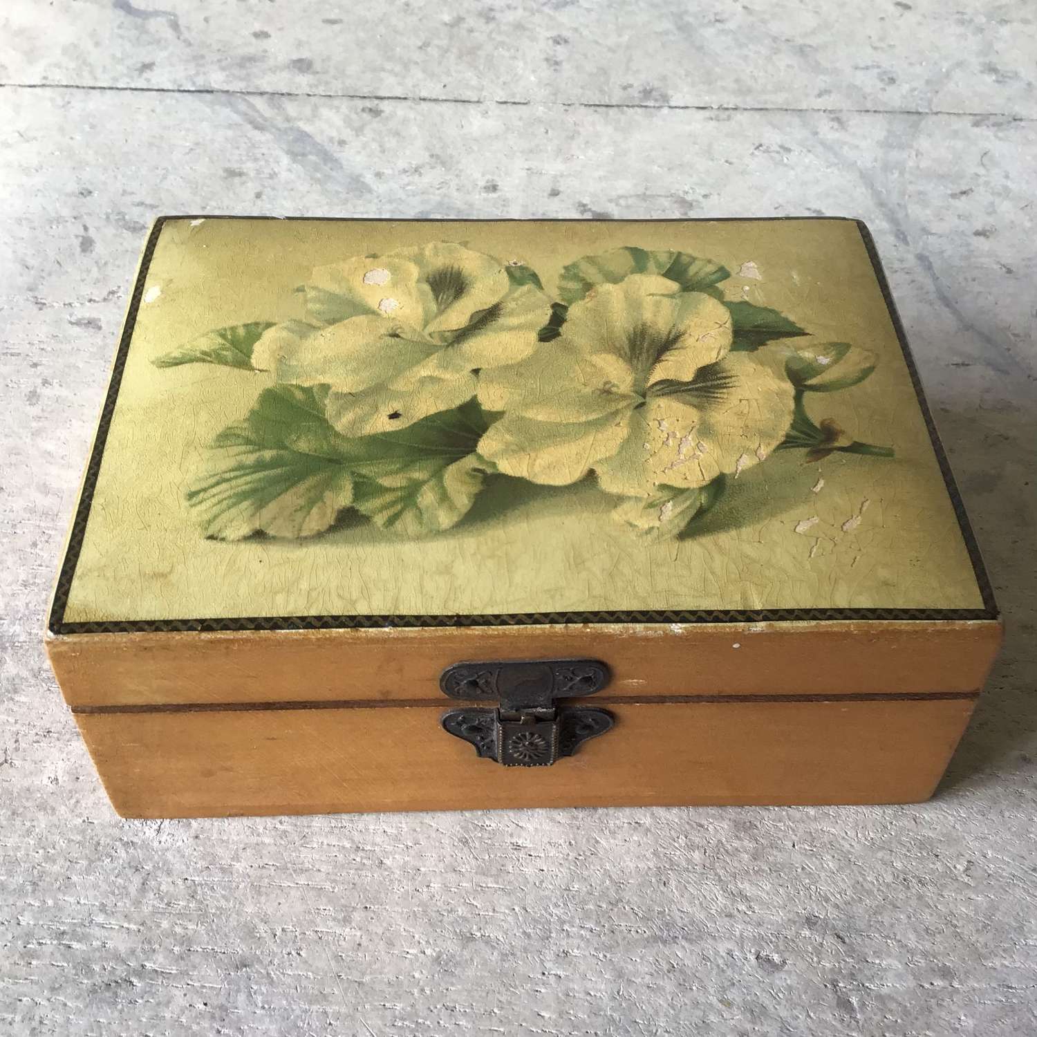 Vintage wooden box with flowers on top