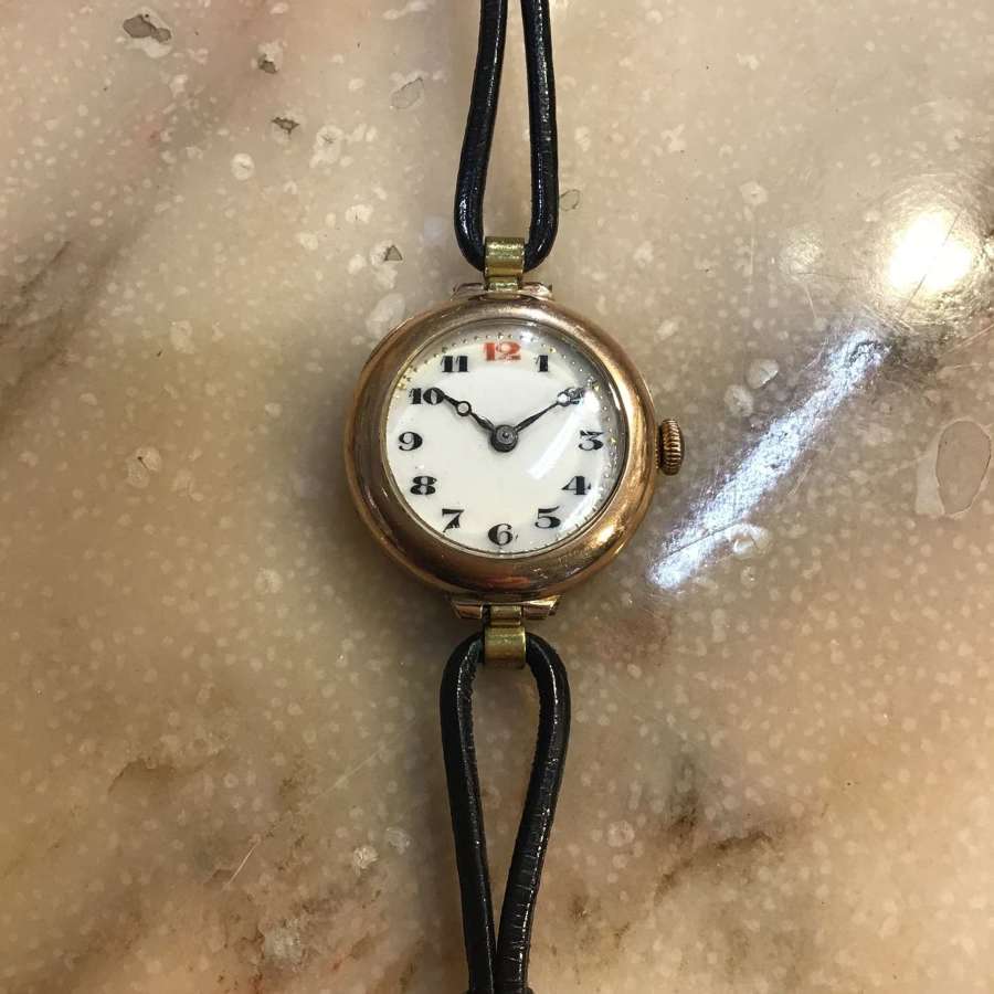 9ct gold antique ladies wristwatch on black  leather strap