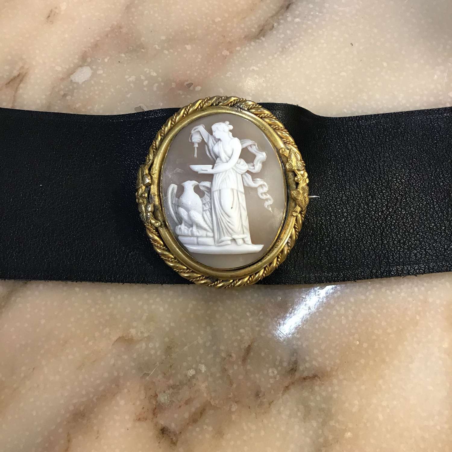 Antique cameo on black leather bracelet