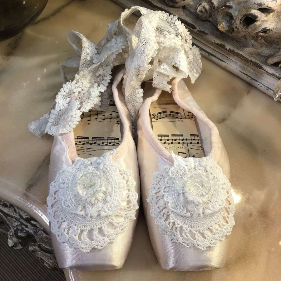 Pretty pale pink ballet pointes with vintage lace and music sheet trim