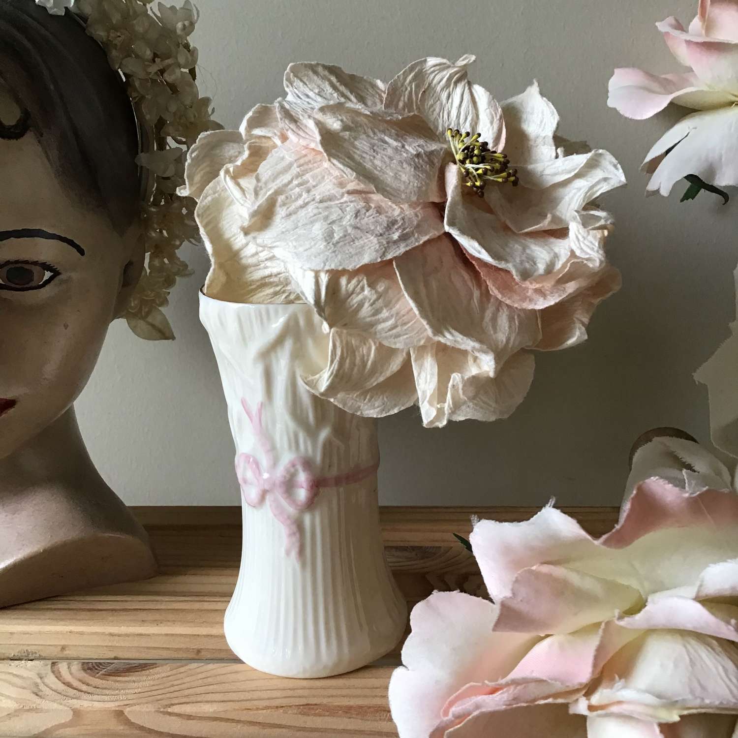 Vintage cream Belleek vase with pink ribbon detail