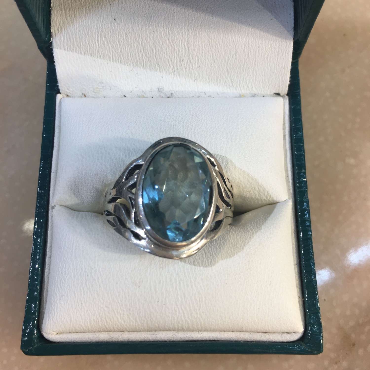 Silver and blue topaz ring