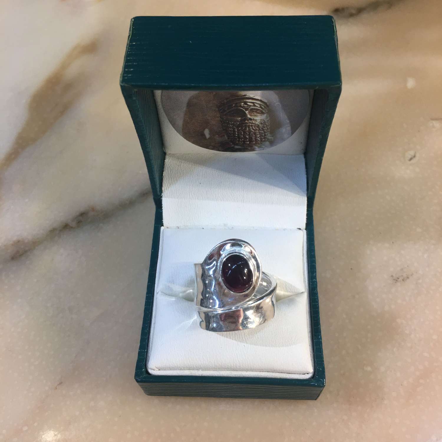 Silver and garnet ring