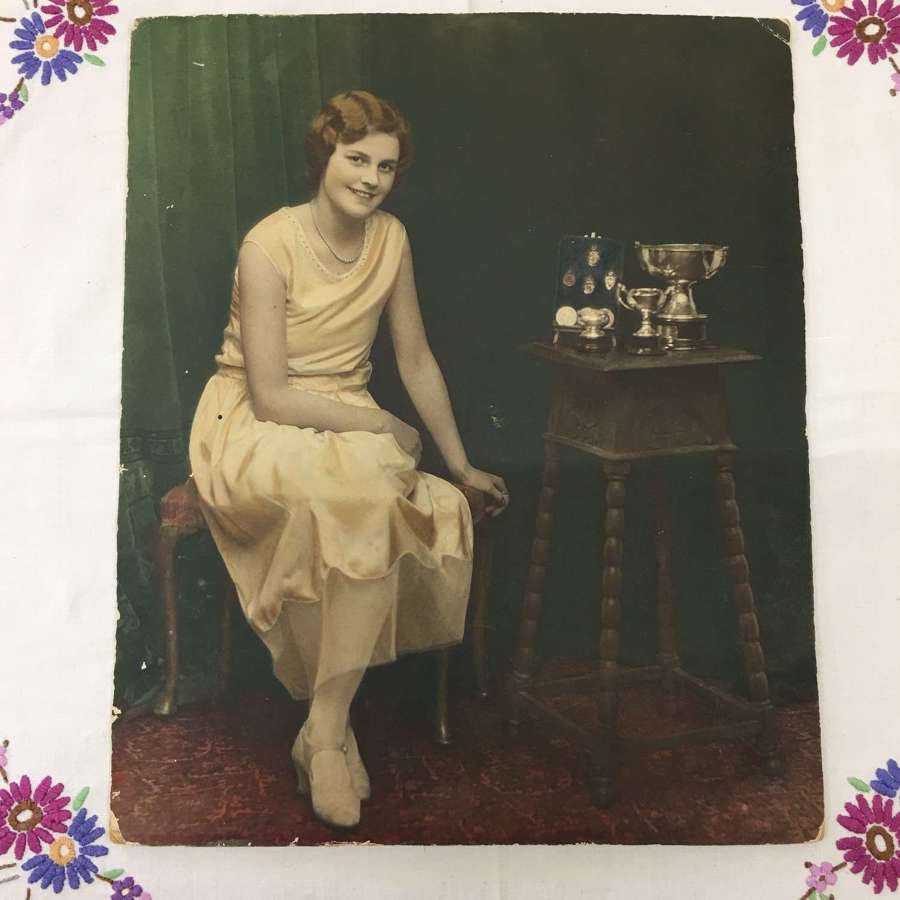 Antique photograph of dancing girl and trophies
