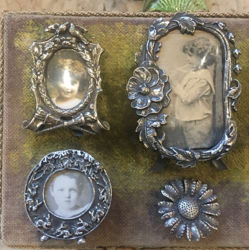 A selection of small silver plated decorative frames