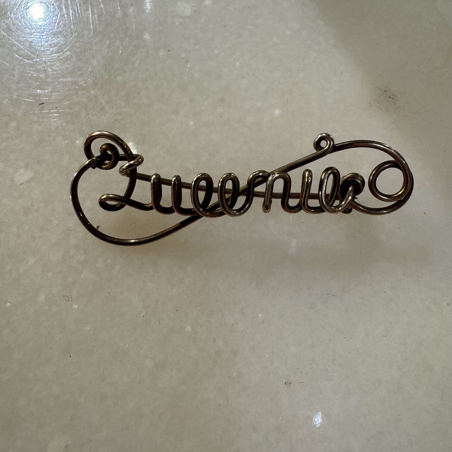 Vintage gold tone name brooch “Queenie”