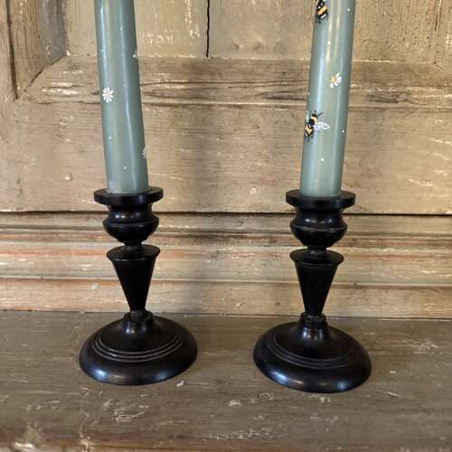 Pair of antique ebony candlesticks