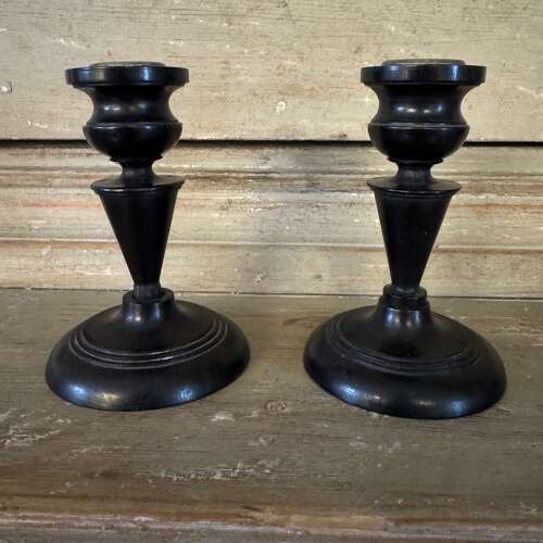 Pair of antique ebony candlesticks
