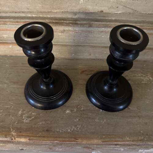 Pair of antique ebony candlesticks