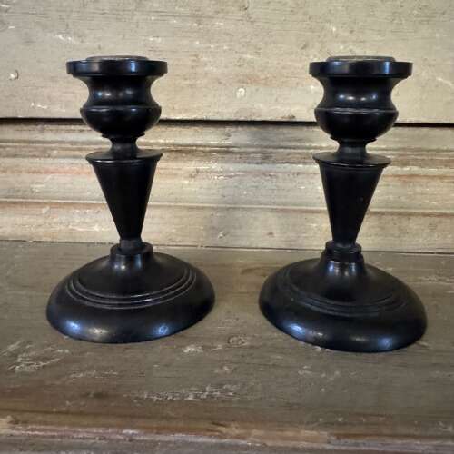 Pair of antique ebony candlesticks