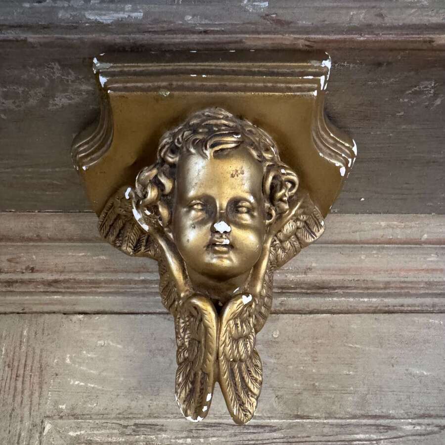 Vintage gilded chalkware cherub sconce